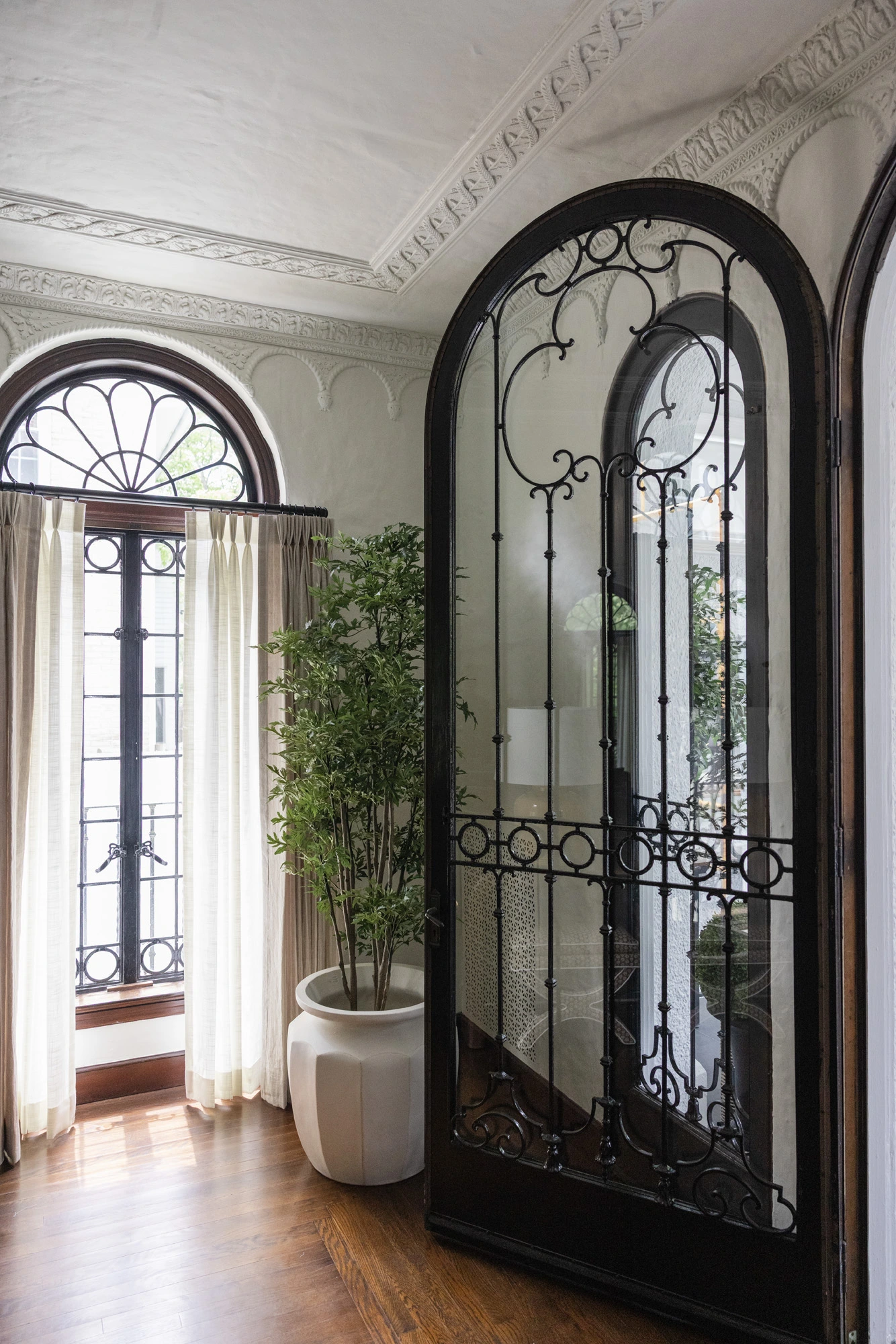 Custom arched ironwork and millwork detail at Project Five Fourteen in Providence, Rhode Island