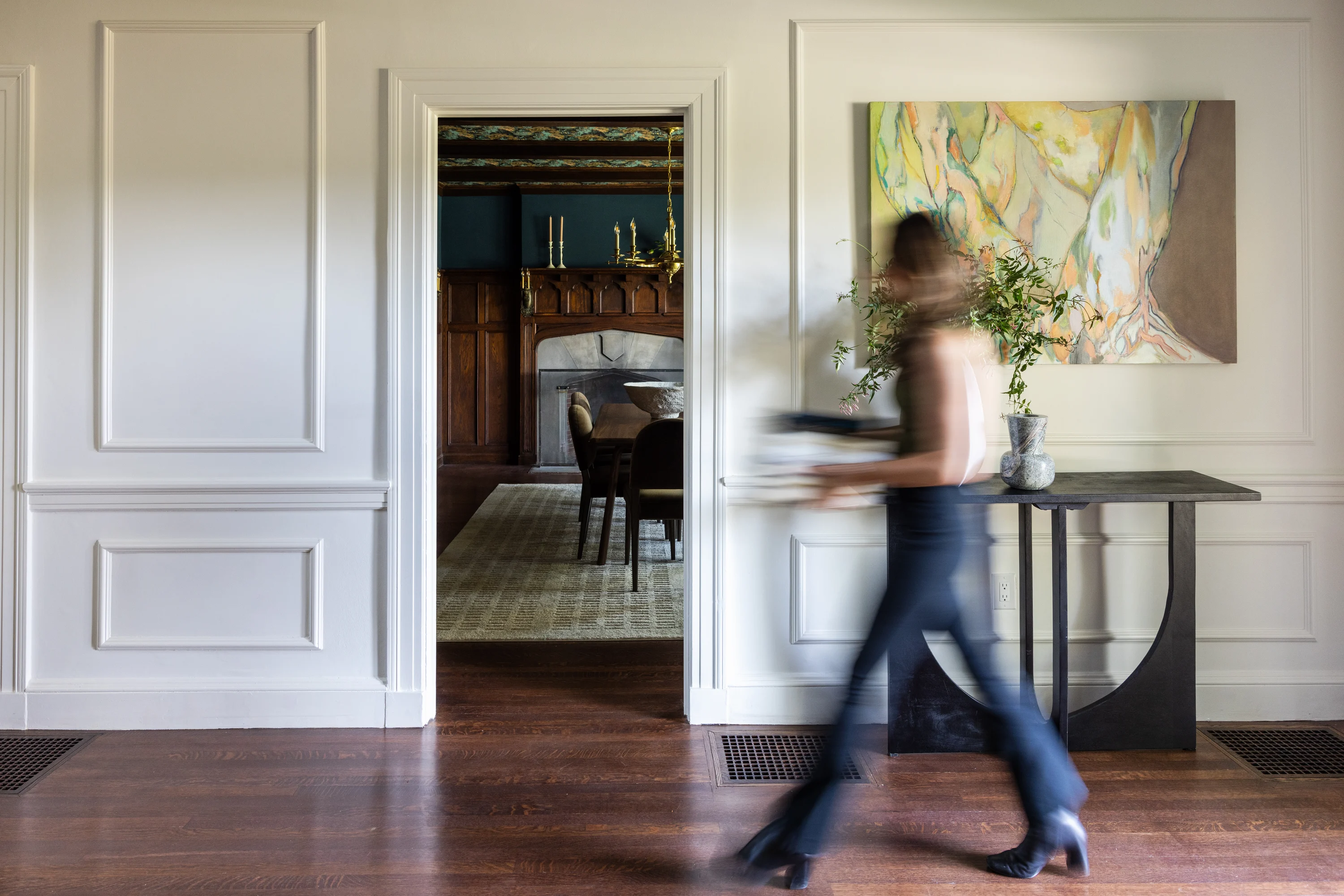 Dining room with navy chairs, wood beams, and arched windows at Project Two Ninety on Blackstone Boulevard in Providence, Rhode Island