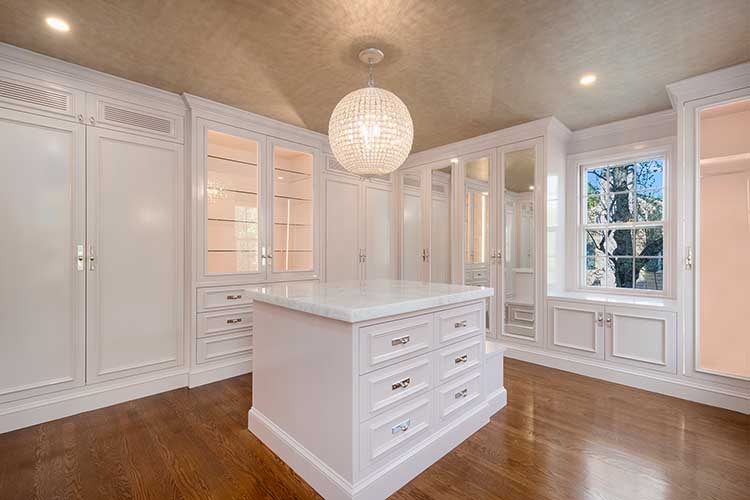 Luxury walk in closet island custom cabinetry