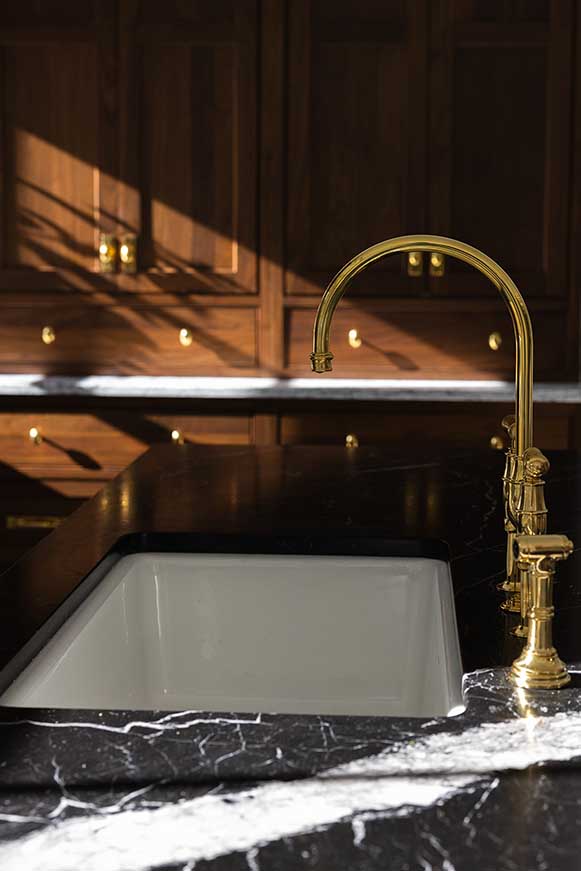 Marble kitchen sink brass faucet detail