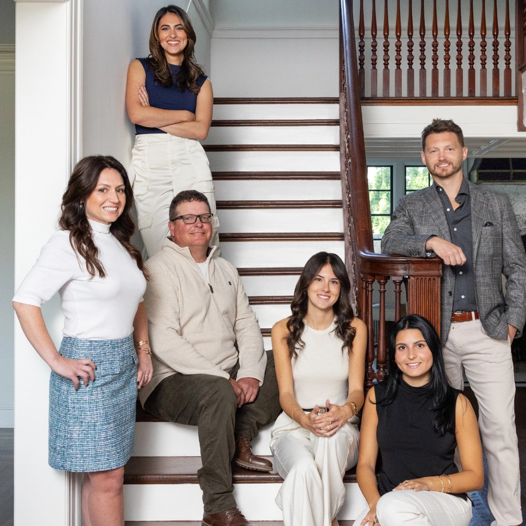 Hill & Harbor team on the studio staircase