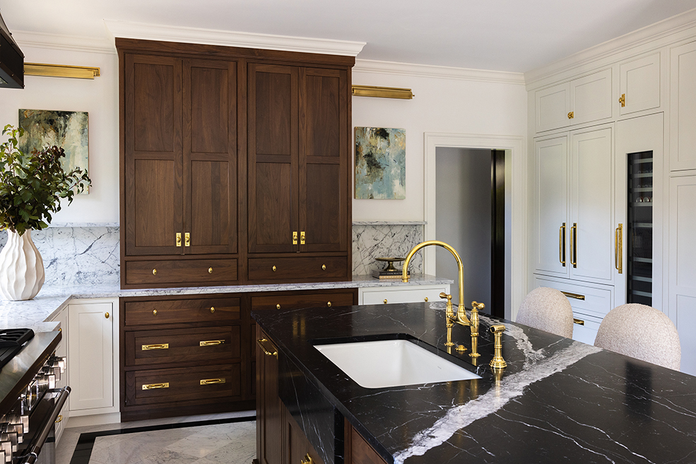 Charming coastal bathroom design featuring nautical whale wallpaper and a classic pedestal sink, honoring the home's seaside location.