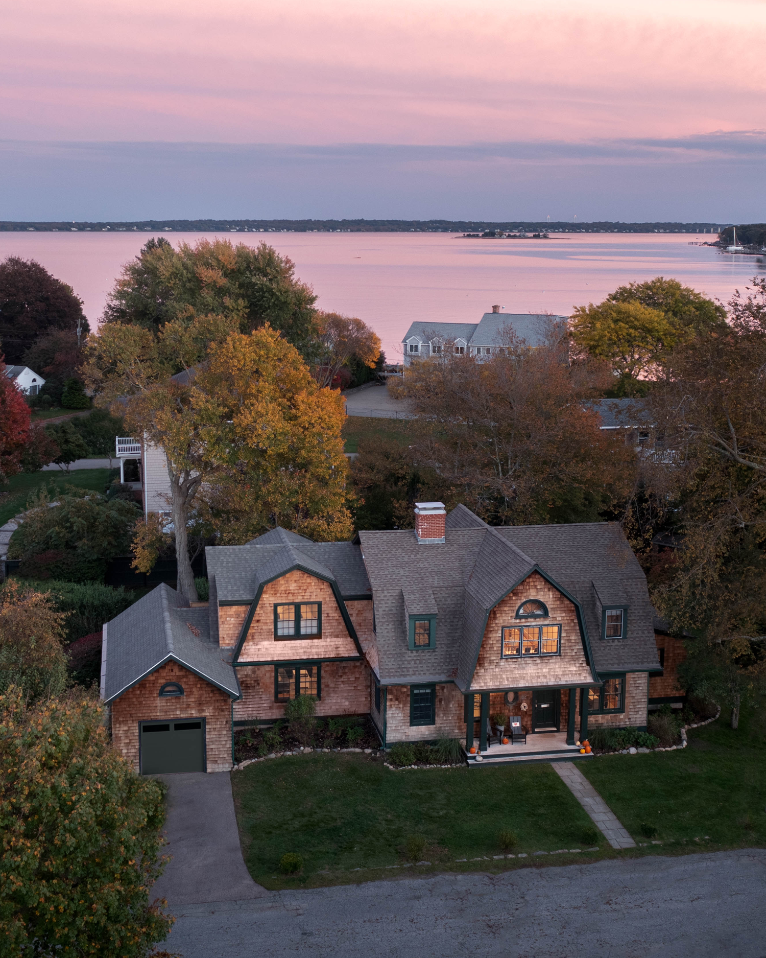 Aerial view of a historic shingle-style home in North Kingstown, RI, showcasing the seamless integration of three new additions.