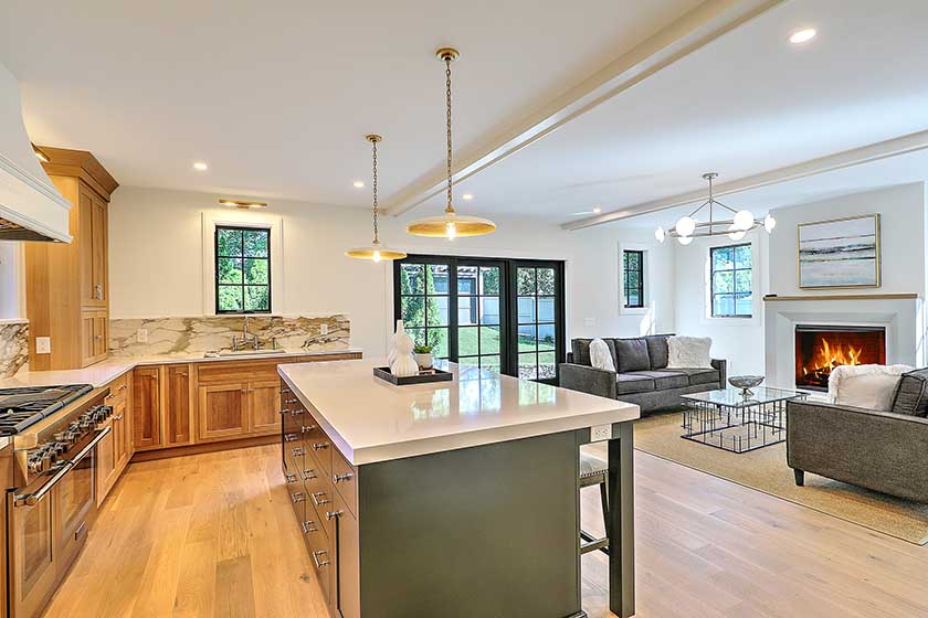 Warm and inviting luxury kitchen design with wide-plank hardwood floors.