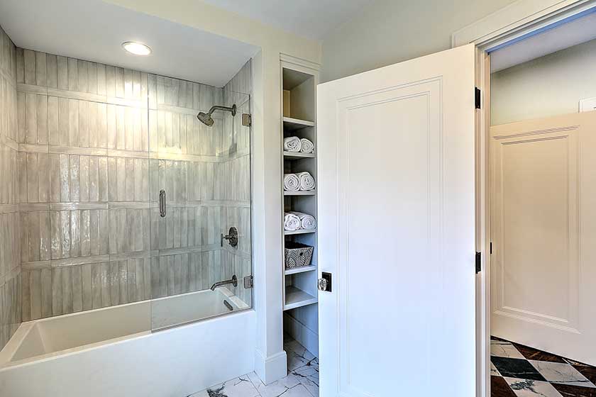 Custom tiled shower niche detail in a renovated Providence bathroom.