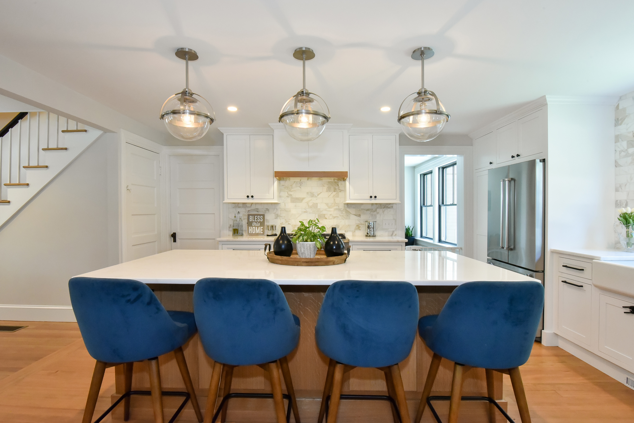 Symmetrical view of the renovated kitchen, highlighting the balance of modern finishes and historic charm.